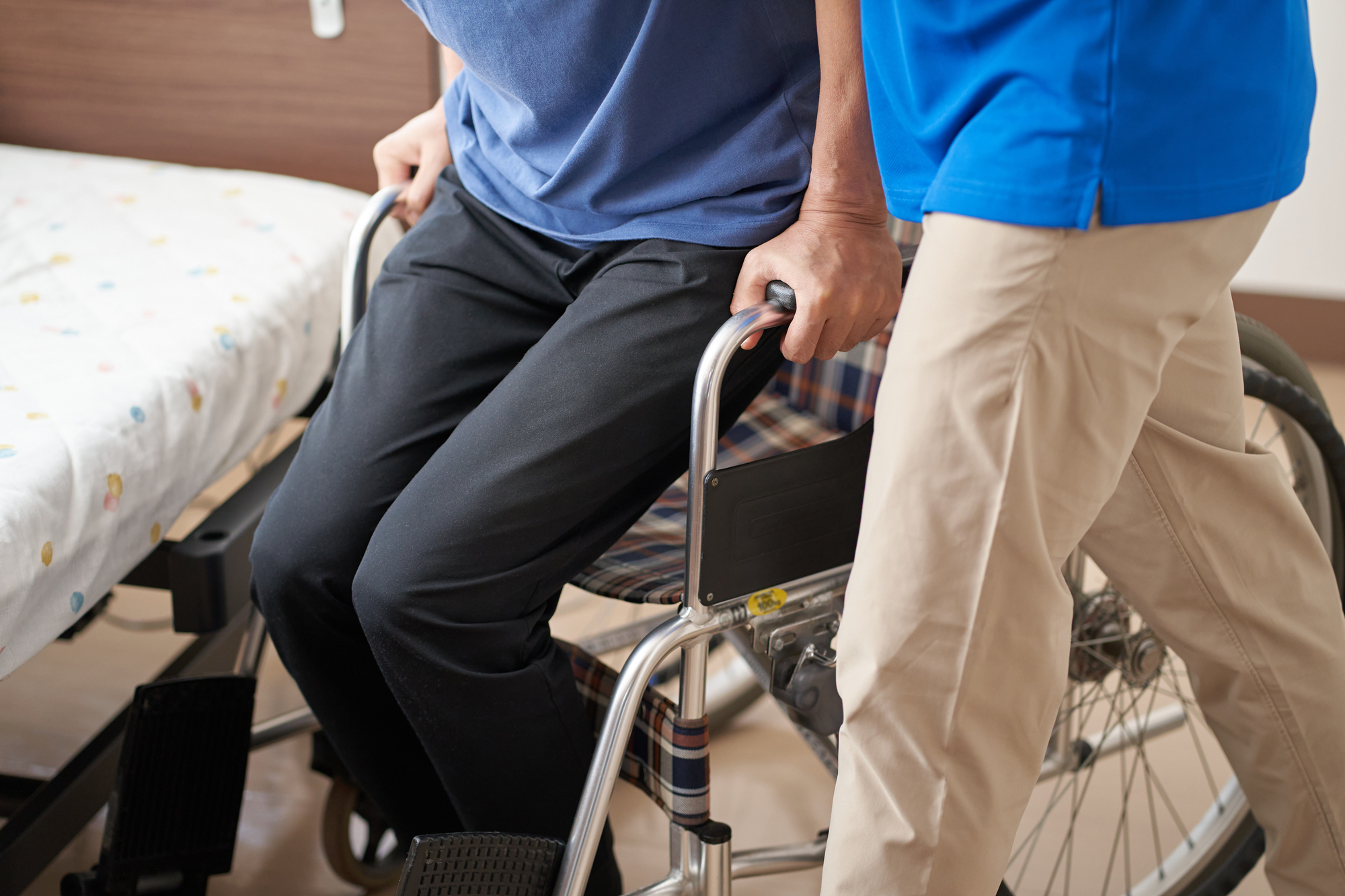 Person comforting an injured driver after a collision, representing the challenges people face when a long-term disability claim is denied following an accident or illness.