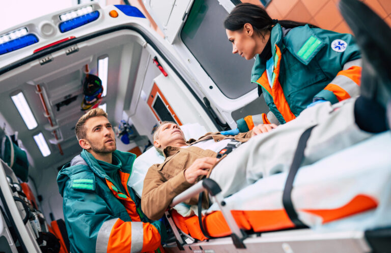 Paramedics treating an injured person after a motor vehicle collision, representing pain and suffering compensation following a serious personal injury in Ontario.