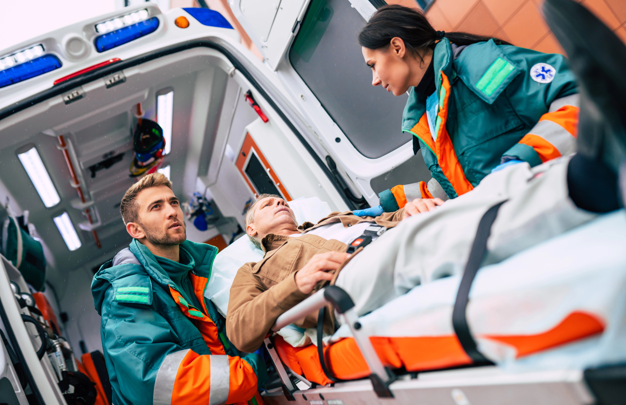 Paramedics treating an injured person after a motor vehicle collision, representing pain and suffering compensation following a serious personal injury in Ontario.