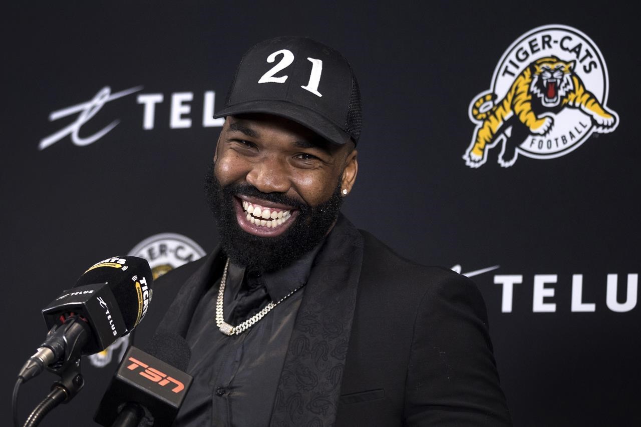 Simoni Lawrence smiling at a microphone